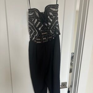 Women’s NWT black holiday/new years sparkly jumpsuit size S